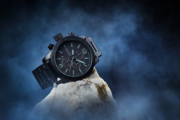 Creative product photography of a man's watch with smoke